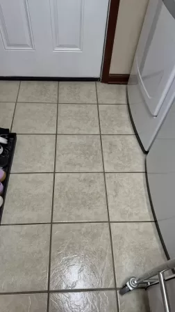 Clean laundry room floor after deep cleaning showing restored original condition