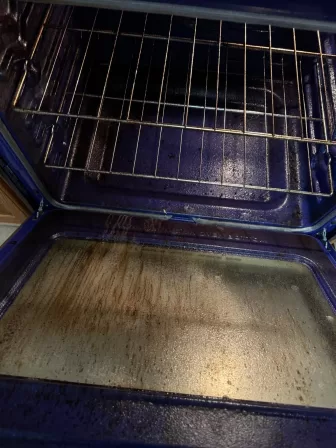 Dirty oven interior showing grease buildup and food residue before Dayton deep cleaning services