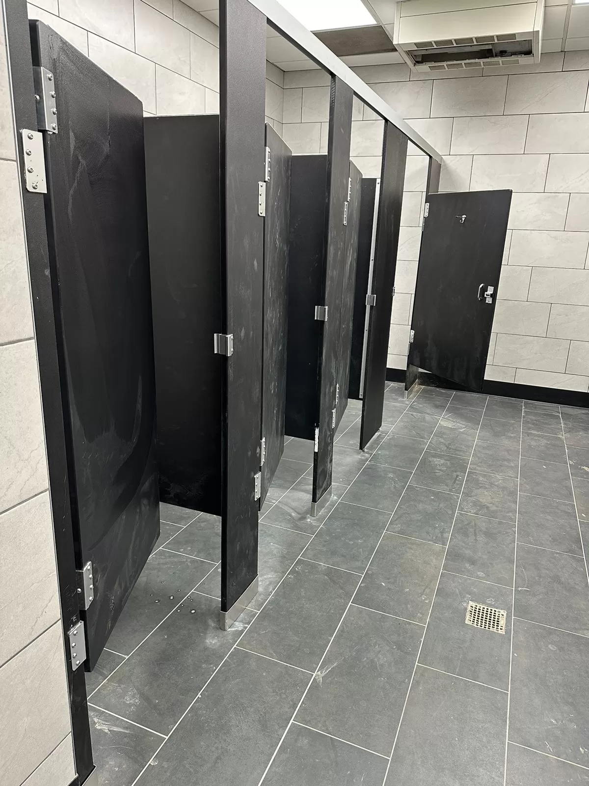 Commercial bathroom before professional deep cleaning