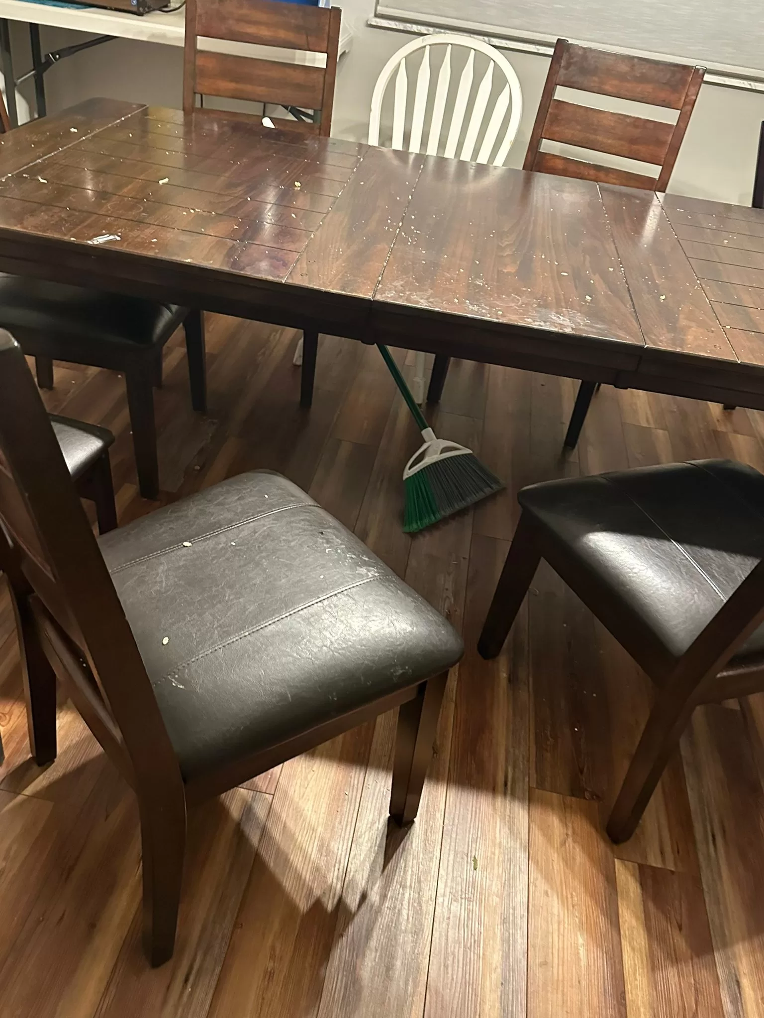 Before AirBnb cleaning service Dayton - Dirty dining table with clutter before AirBnb cleaning service