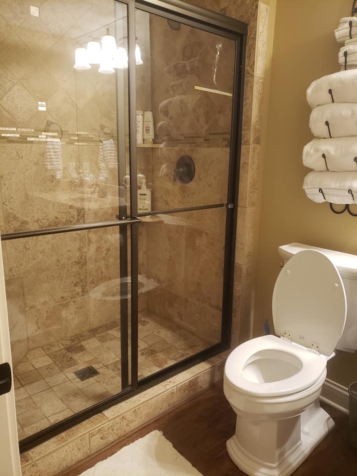 Professional bathroom cleaning results showing spotless shower and bathtub in Dayton OH