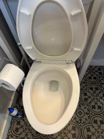 Spotless toilet after Dayton deep cleaning services showing complete sanitization and shine