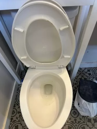 Dirty toilet showing stains and buildup before professional Dayton deep cleaning services
